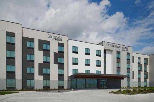 a large white building with a sign on it at TownePlace Suites by Marriott Columbus in Columbus