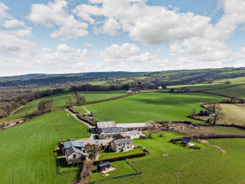 an aerial view of a house in a green field at 2 Bed in Narberth 72864 in Whitland