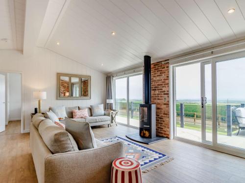 a living room with a couch and a fireplace at 2 Bed in St Andrews 83173 in Anstruther