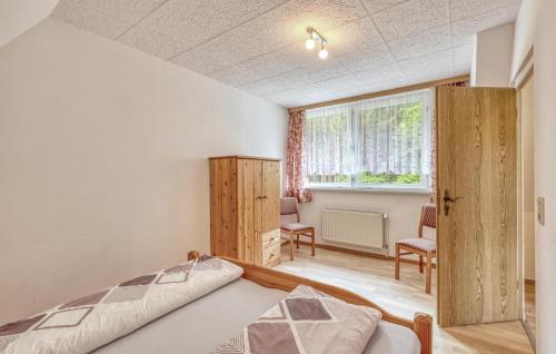 a bedroom with a bed and a window at Ferienwohnung Blankensee in Blankensee