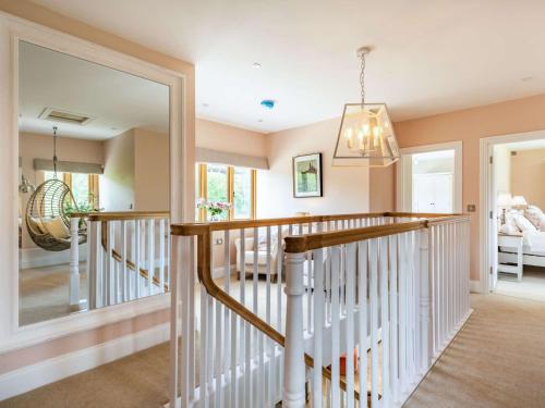 a staircase in a home with a mirror at 4 Bed in Chirk 87675 in Chirk
