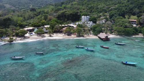an aerial view of a beach with boats in the water at Habitaciones con wifi a 5 minutos de la playa in Capurganá