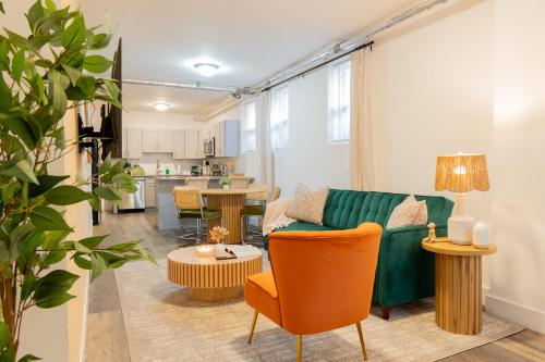 a living room with a couch and a table at Moderno 1BR - Parking - 15 min NYC in Jersey City