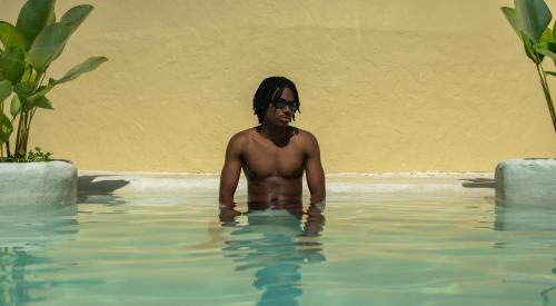 a man in a swimming pool in the water at Villa Venecia in Venecia