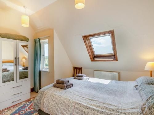 a bedroom with a bed with two stuffed animals on it at 2 bed property in Thurlestone WDELV in Thurlestone