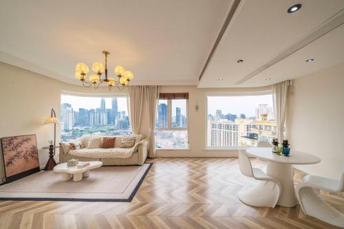 a living room with a couch and a table at Book and Bed-Yuyuan 2 in Shanghai