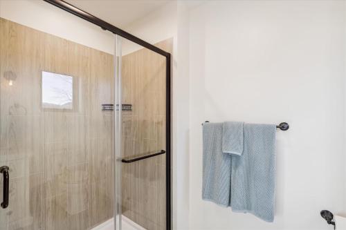 a bathroom with a shower with a glass door at Sterling Ridge View in Stowe