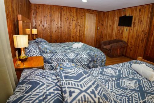 Postel nebo postele na pokoji v ubytování Hostal Chumay