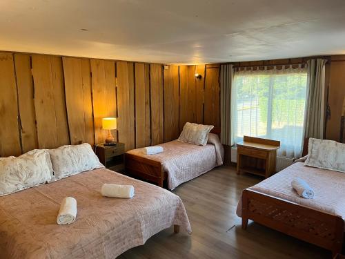 Postelja oz. postelje v sobi nastanitve Hostal Chumay