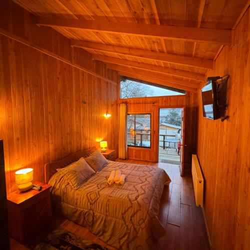 Postel nebo postele na pokoji v ubytování Hostal Chumay