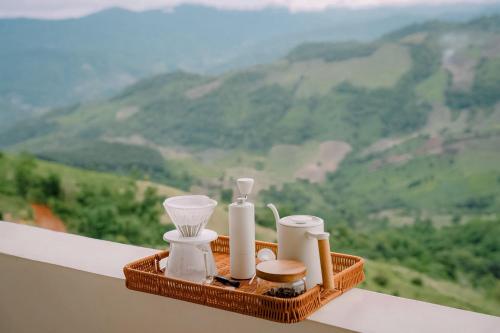 a tray with candles and other items on a ledge at Nontawa Villa Doichang in Ban Huai Khai