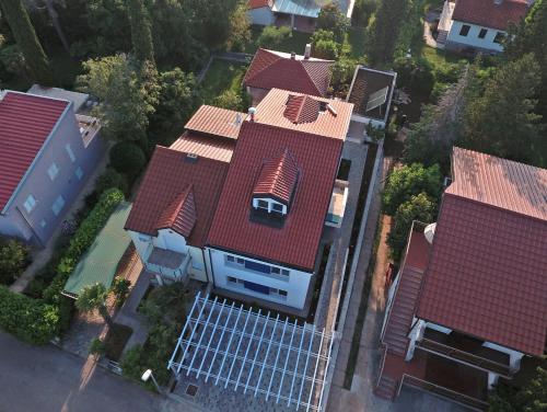 an overhead view of a house with a roof with solar panels at Apartments Petra in Njivice