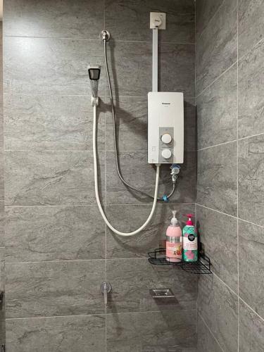 a shower in a bathroom with a soap dispenser at Blue Aesthetic Luxury Seaview 3 min Drive Sunway in Butterworth