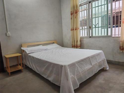 Postel nebo postele na pokoji v ubytování Close to Huangjin Airport, West High-speed Railway Station, and convenient homestay at Zheshan resettlement site