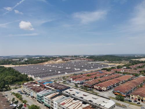 an aerial view of a parking lot with buildings at Ilsham Guest House @ Seroja Hills BBST Sepang in Sepang