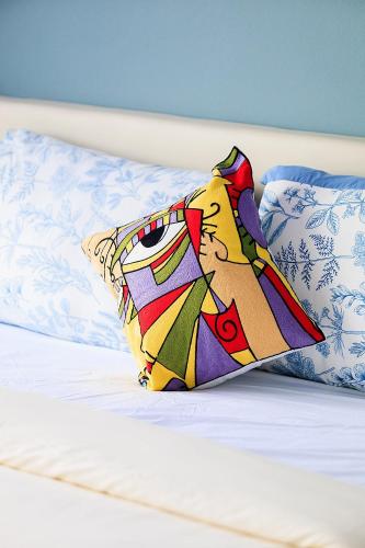 a pillow sitting on top of a bed with pillows at V228 Renovated 3BR Pool Villa Near Top Beaches in Bang Rak Beach