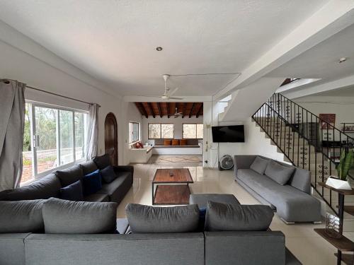 a living room with a couch and a table at Casa Gabriela in Bucerías