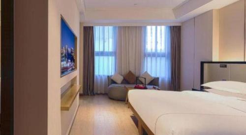 Ένα ή περισσότερα κρεβάτια σε δωμάτιο στο The Hotel V Nanjing Confucius Temple