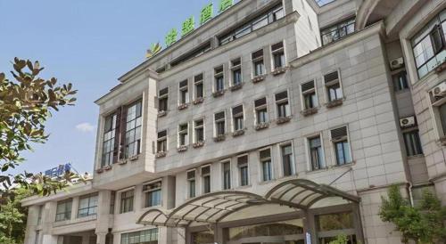 a large white building with a lot of windows at GreenTree Alliance Hotel Shanghai Baoshan District Meilan Lake Yueluo Road in Baoshan