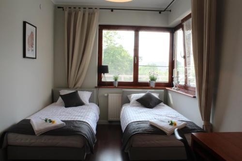 En eller flere senger på et rom på 3D Poznańska 6 Apartament