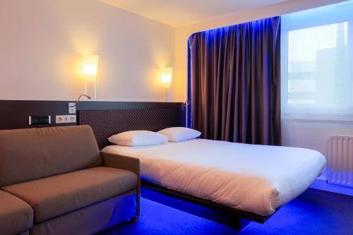 Postel nebo postele na pokoji v ubytování ibis Styles Lorient Caudan