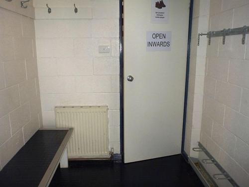 a door with a sign on it in a room at Sun Valley Apartment 7 in Falls Creek