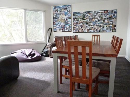 a dining room with a wooden table and chairs at Sun Valley Apartment 7 in Falls Creek