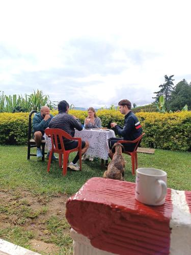 a group of people sitting at a table at Cabaña Momotus II in Concepción