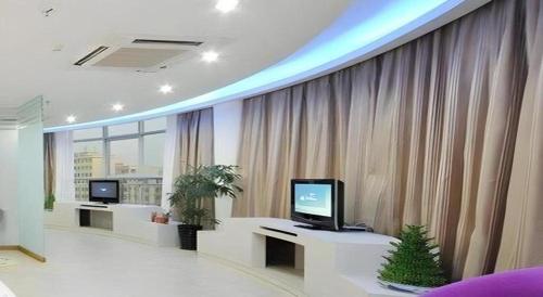 TV a/nebo společenská místnost v ubytování Wanxiang Hotel