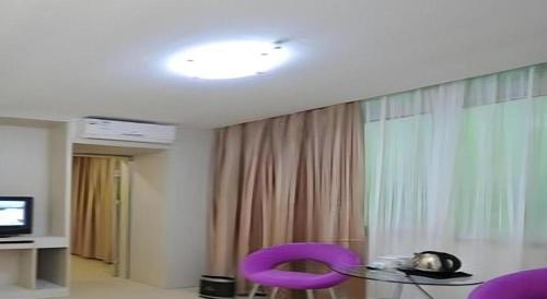 TV a/nebo společenská místnost v ubytování Wanxiang Hotel