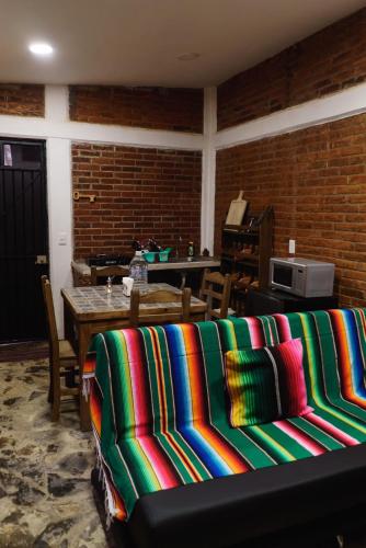 a living room with a couch and a table at Find Your Perfect Mountain Retreat at House fire 