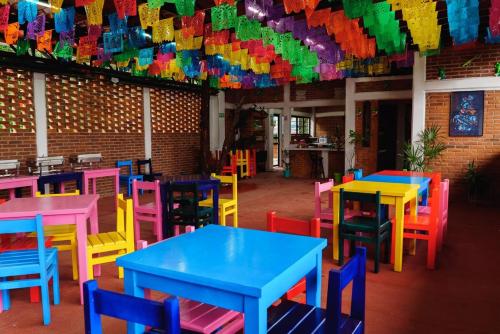 a room with tables and chairs with colorful tables at Find Your Perfect Mountain Retreat at House fire 