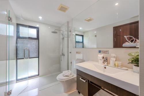 a bathroom with a sink and a toilet and a shower at C219 1BR Island Hideaway 500m to Rawai Beach in Rawai Beach