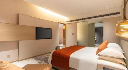 Zhangjiagang Guomao Hotelにあるベッド