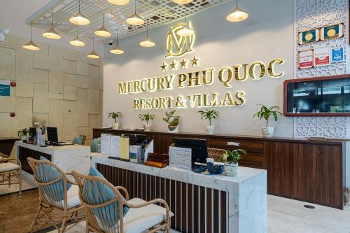 a restaurant with a sign that reads mercury phoenix repair and villas at Mercury Phu Quoc Resort & Villas in Phu Quoc