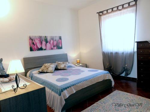 Un pat sau paturi într-o cameră la Villa GenVì - casa vacanza