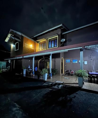 a house lit up at night at Rob Roy in Beruwala