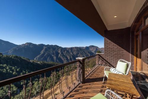 a balcony with a view of the mountains at The Manor Luxury Apartments, Shimla in Mashobra