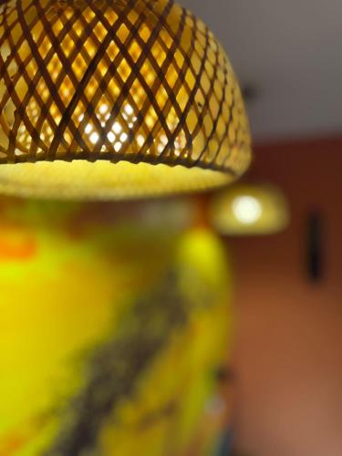 a close up of a lamp with a yellow light at Savanaïa in Tourcoing