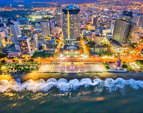 an aerial view of a city at night at S79 Residence LYN Panorama in Nha Trang