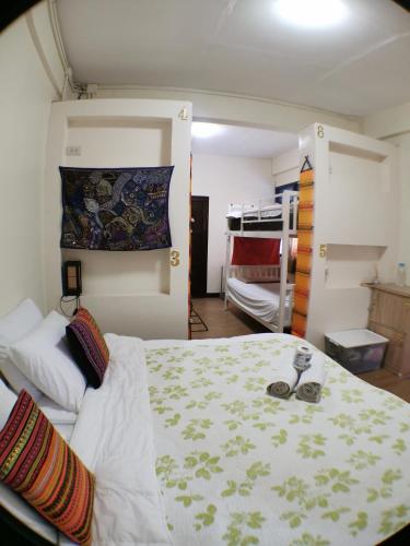 a bedroom with a bed and a bunk bed at Indy house59 in Bangkok