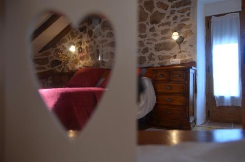 Ένα ή περισσότερα κρεβάτια σε δωμάτιο στο Hostal Refugio De Gredos