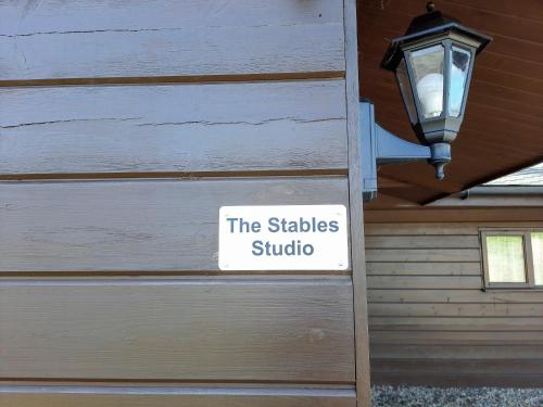 a sign on a building that says the stables studio at The Stables Studio in Haydon Bridge
