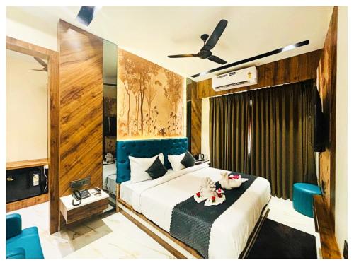 a bedroom with a bed and a ceiling fan at Hotel Moresta Restaurant and Bar Best Facility in Ajmer