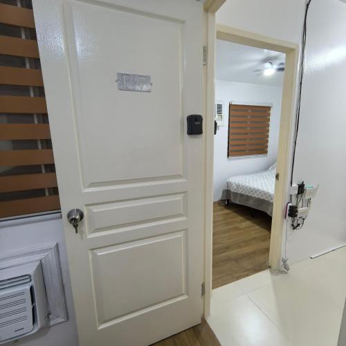 Postel nebo postele na pokoji v ubytování Davao City Airport Transient Rooms by Lemonique