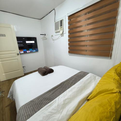 Postel nebo postele na pokoji v ubytování Davao City Airport Transient Rooms by Lemonique