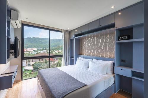 Ένα ή περισσότερα κρεβάτια σε δωμάτιο στο C223 Condo 1BR Suite with Rooftop Pool 1km to Beach