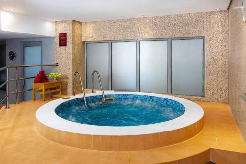 a hot tub in the middle of a room at The K Hotel in Manama