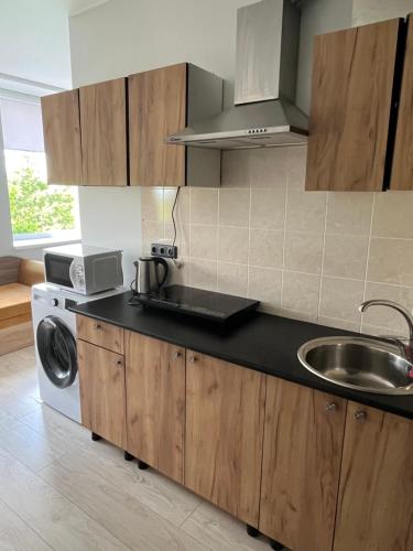 Η κουζίνα ή μικρή κουζίνα στο Apartamentai 1