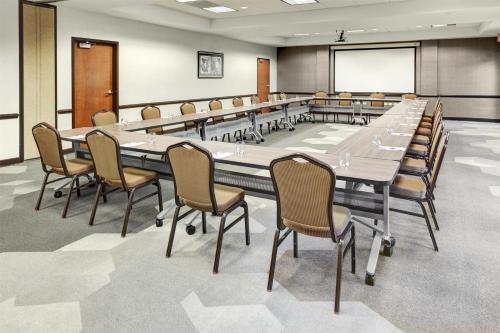 a large conference room with a large table and chairs at Hyatt Place Detroit/Auburn Hills in Auburn Hills